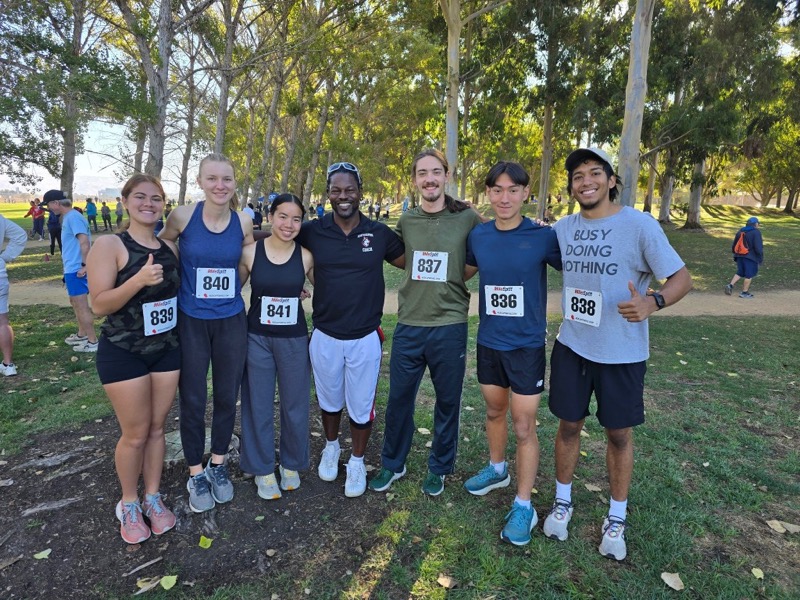 Alex running with his team